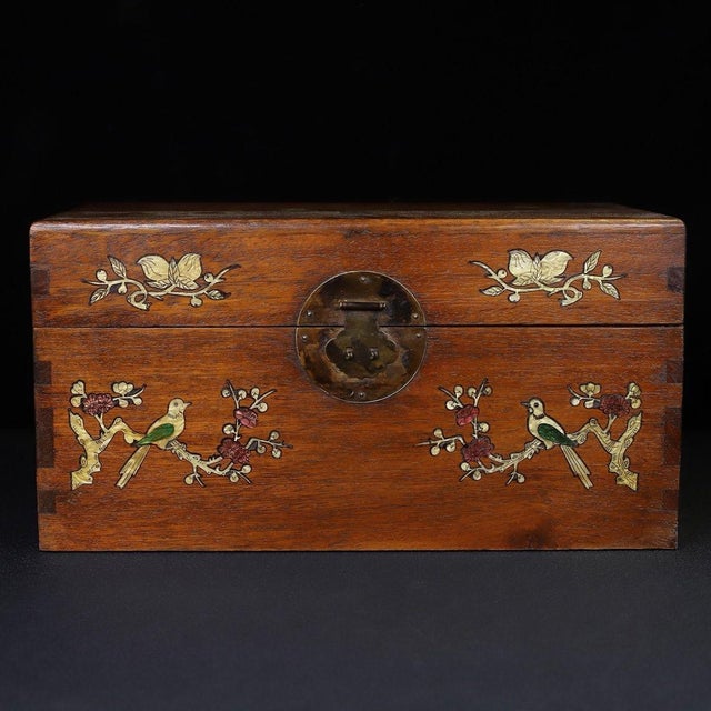 A beautifully crafted Chinese rectangular box, likely made of Huali (rosewood). The box features a hinged lid with brass...
