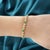 5.51 CTW Diamond and 1.52 Carat Emerald Bezel Set 14K Yellow Gold Tennis Bracelet of 7 Inches. Box Closure. Set with...