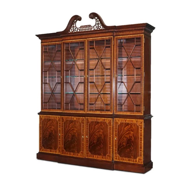 Large Georgian-style mahogany breakfront bookcase Councill furniture. It has four glass doors with wood mullions framed...