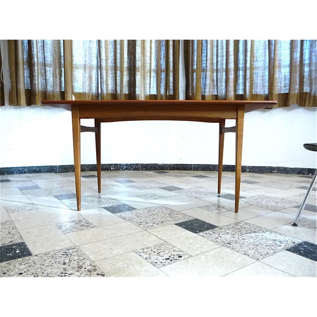This Danish modern teak coffee table from the early 1960s features a strong wood grain.