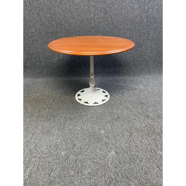 Kenneth Lynch & Sons outdoor cocktail pedestal table. Complete welded construction with cast aluminum base and wood top....