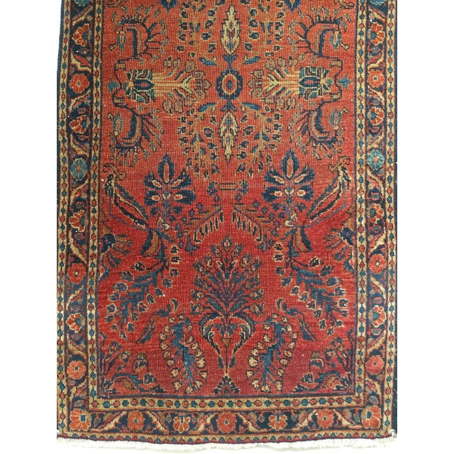 A beautiful antique Persian Lilian Sarouk rug from the early 1900s, handwoven in the renowned weaving region of Western...