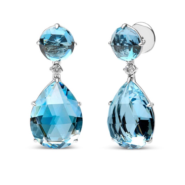 These attractive dangle earrings cultivate a sophisticated style in genuine 18k white gold with natural gemstones and...