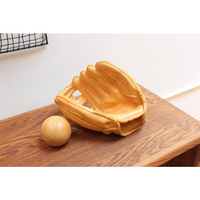Fantastic trompe L'Oeil baseball glove and ball hand carved by Afonso Bini in his workshop in Florence, Italy. Life size....