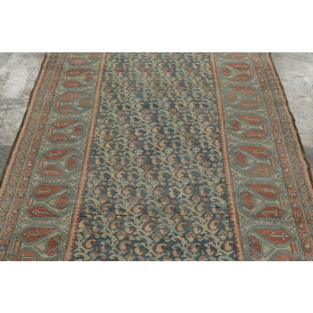 Hand-knotted in wool, this 4x9 circa 1900-1920, rug is a refined addition to Rug & Kilim’s vintage rug collection. The...