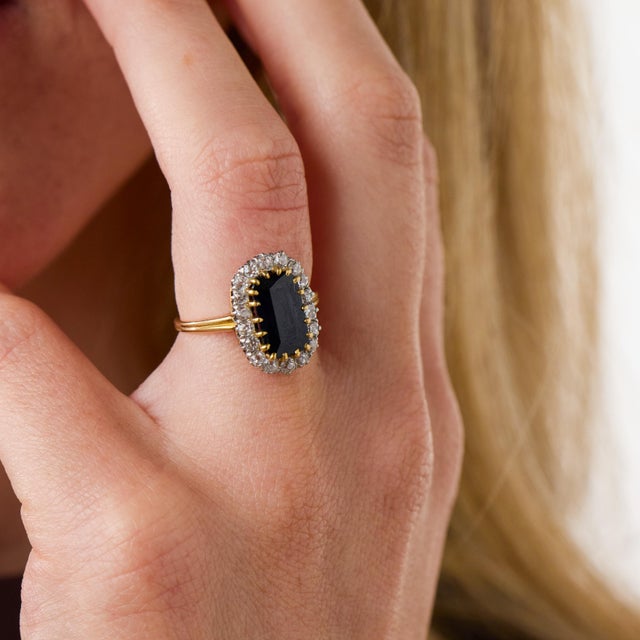 This exceptional Edwardian cluster ring is a beautifully refined jewel from the 1910’s, centered by a GIA-certified...