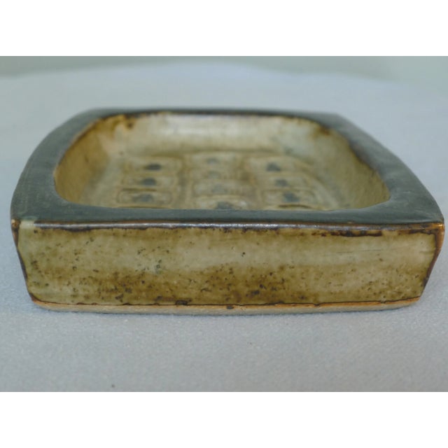 Rectangular stoneware bowl from Royal Copenhagen with embossed motifs. Designed by Jørgen Mogensen in the 1960s. Model...