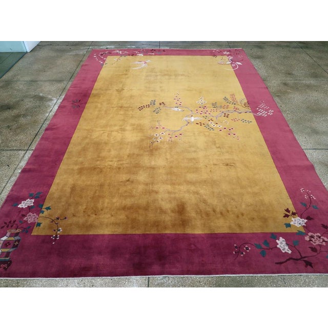 An antique Chinese Art Deco room size carpet handmade during the early 20th century. Measures: 10' 1" x 14' 10"