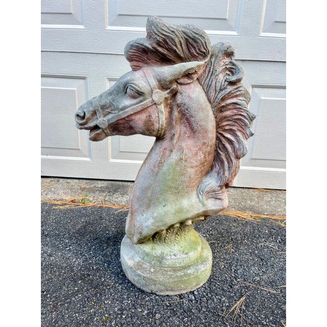 Monumental concrete horse head sculpture with desirable patina from age. Unmarked. Dims: 14" L x 8" W x 23.5" H. Store...
