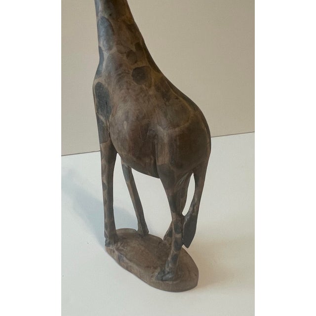 Hand carved 12” tall Giraffe. This detailed African animal figure was carved in Kenya