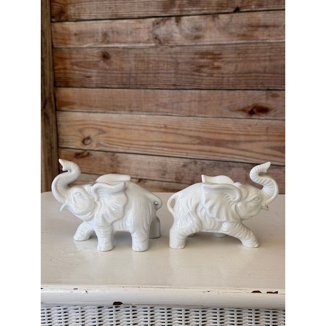 Hollywood Regency Pair of Vintage Inarco White Glazed Elephant Figurines With Raised Trunks For Sale - Image 3 of 12
