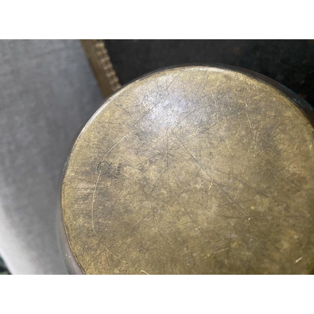 Behold this exquisite wmf (württembergische metallwarenfabrik) ikora vase, crafted from patinated bronze and featuring a...