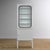 Vintage medicine cabinet from the 1970s, produced in Hungary. This cabinet is made of iron and glass, with the glass held...