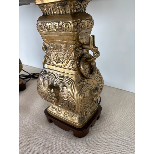 Vintage Pair Asian Archaic Brass Urn Lamps James Mont Style With Linen Shades For Sale - Image 9 of 15