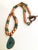 Handcrafted with an artful balance of warm copper and rich green gemstones, this one-of-a-kind statement necklace evokes...