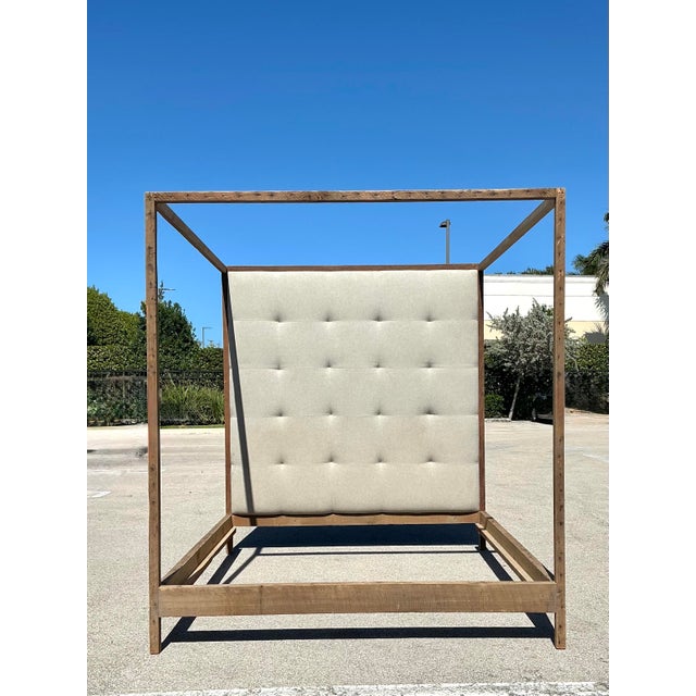 This monumental King-sized canopy bed offers a masterful blend of rustic materiality and sophisticated modern design. The...