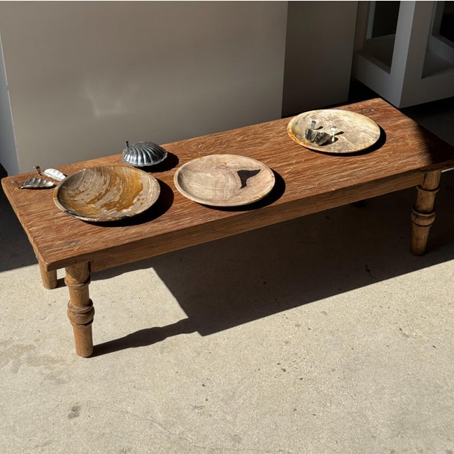 A small, round tray, dish, or plate made of petrified wood. Petrified wood is a fossilized wood (from the same family as...