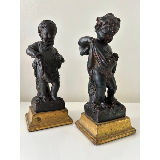 Elegant, classic set of two Italian "carini cherubini" or putti figurines by Borghese, circa early 20th century. Partial...