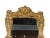 A fine Regency-style gilt-carved wooden mirror。This mirror embodies the essence of the Regency style, with its rectangular...