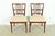 An exceptional pair of Mid-Century Modern spindle back side chairs or dining chairs In the manner of Paul McCobb USA,...