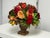 Design Plus Gallery presents a Classical Faux Rose + Fruit Floral Arrangement. The composition includes roses and garden-...