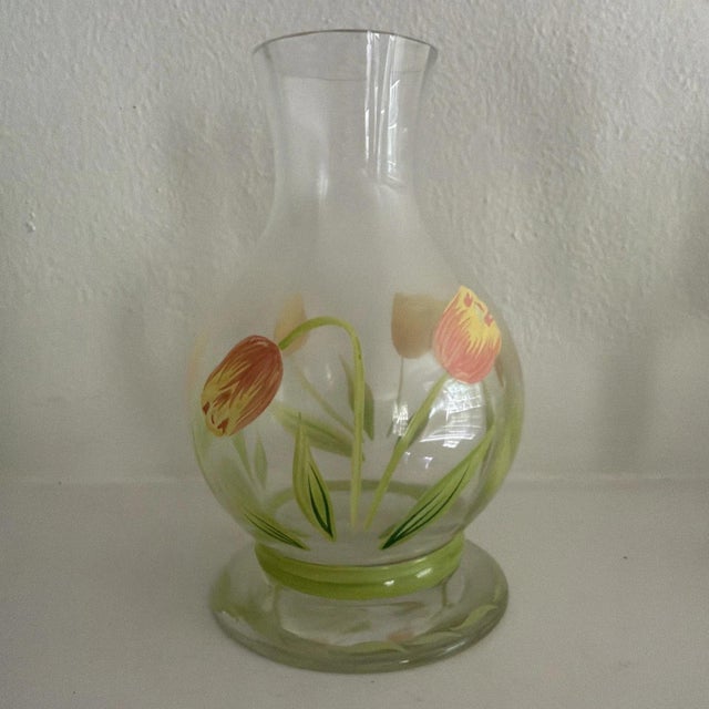 The Princess House Cottage Tulip Carafe, Goblets, and Votive Holder set is a delicate and elegant piece of pottery and...