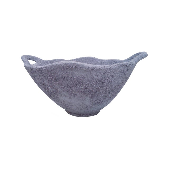 Earthy, sculptural, and effortlessly refined, this bowl brings a grounded, organic presence to any space. Crafted with a...