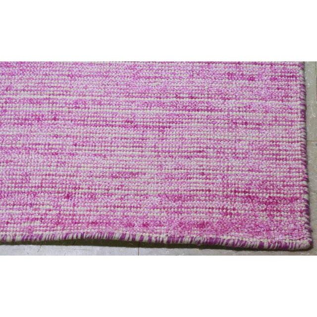 Hand-knotted with care using traditional rug making techniques, this wool rug blends timeless craftsmanship with a modern...