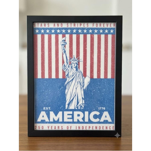 Classic patriotic framed wall art featuring the Statue of Liberty motif. Bold blue and red palette brings Americana style...