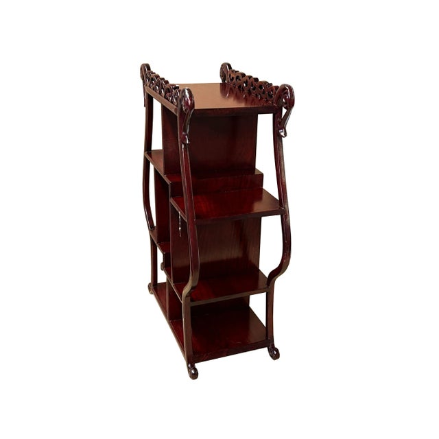 This elegant and functional piece of furniture is perfect for showcasing your treasured collectibles. The stand features a...