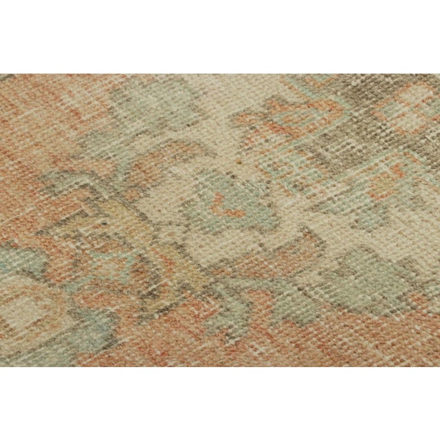 Made with hand-knotted wool, this 1x3 gift-sized vintage Turkish rug originating circa 1950-1960, is from the collection...