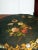 This listing is for a paper mache tilt top table with mother of pearl inlays and decorated with hand painted gold trims...