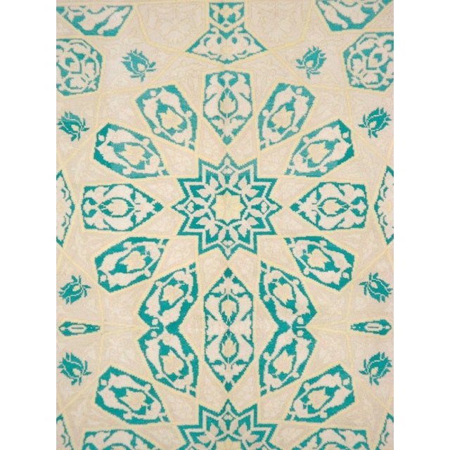 A vintage Indian Cotton Agra carpet from the mid-20th century. A classic all cotton northern Indian Agra carpet with two...