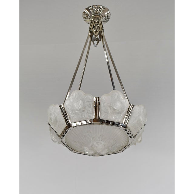 Maurice Model - Cristalleries de Verdun A large French art deco chandelier in nickel plated solid brass or bronze made...