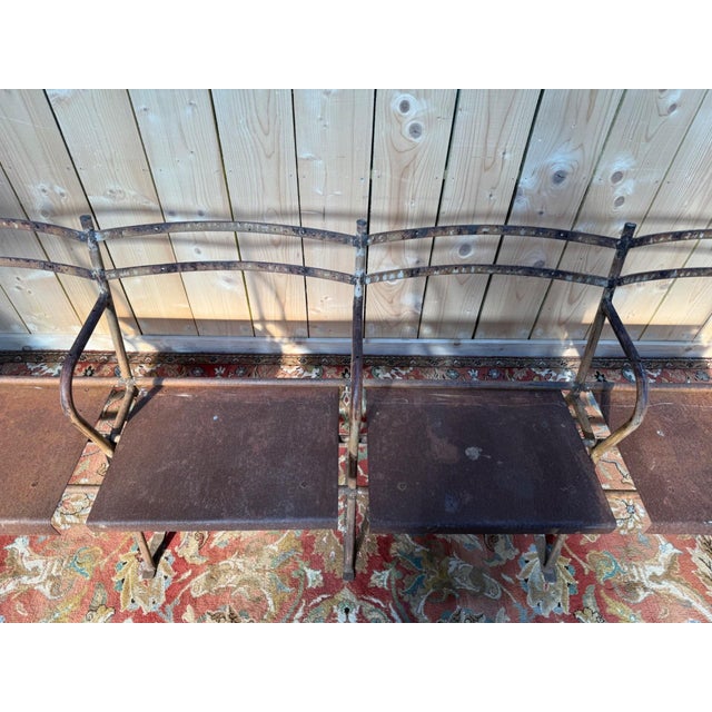 Four-seater public hall bench, made entirely of iron and sheet metal, dating from the early 20th century (1900-1920). The...