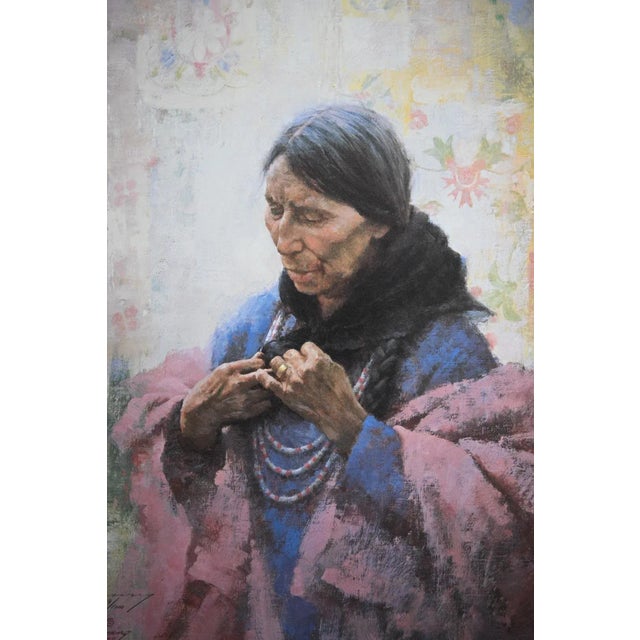 Cree Finery by Howard Terpning captures the quiet dignity of a Cree woman preparing her beaded necklaces against a softly...