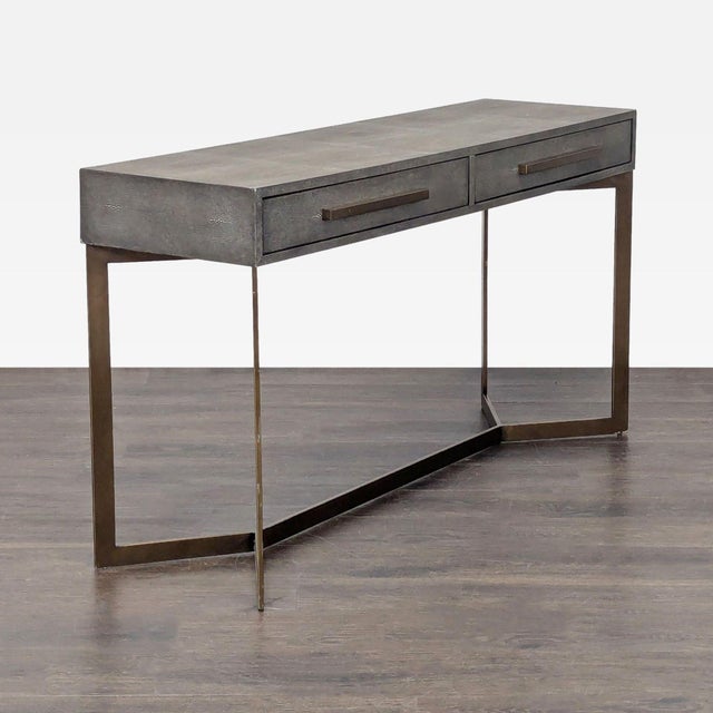 Natural shagreen is a stingray-sourced upholstery. This faux version is a look-alike made of embossed bonded leather. The...