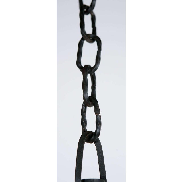 1860's Black Iron Italian chandelier with dragon detail and finely wrought chain. The chandelier is newly wired with four...