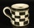 English Creamware Checkerboard Child's Mug, Circa 1820–1850 Circa 1820–1850 This English child's mug is finely potted in...