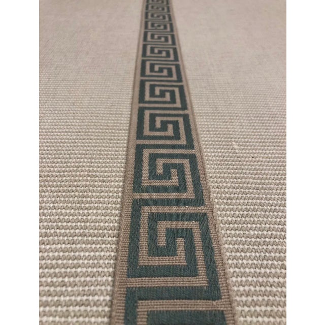 This band from Classical Elements has a classic teal greek key pattern on a neutral oatmeal band. It makes a beautiful...