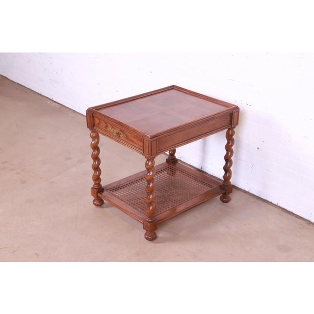 A gorgeous Jacobean style English barley twist tea table or occasional side table By Baker Furniture USA, Circa 1970s...