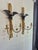 Standout pair of Italian parcel gilt carved wood two light wall scinces featuring eagles,chains,medallions and tassles.
