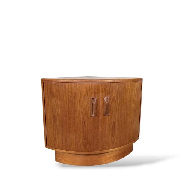 This teak corner cabinet offers a stylish storage solution designed to maximize space with compact storage cabinet...