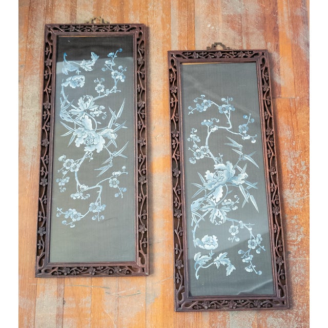 We are selling this pair of Chinese silk panels with frames. These nice silk panels have prunus and floral design in blue...