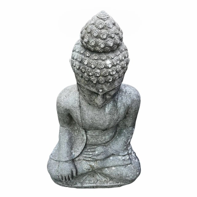 Serene vintage sitting Buddha statue carved from stone. Perfect for your garden, can be placed outdoors or indoors....