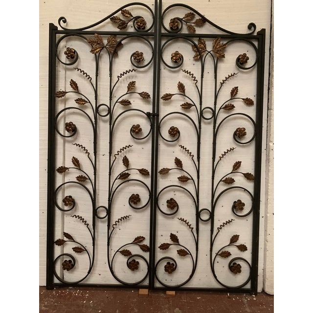 Double wrought iron partition doors Two leaves decorated with scrolls and foliage in gilded sheet metal Good condition...