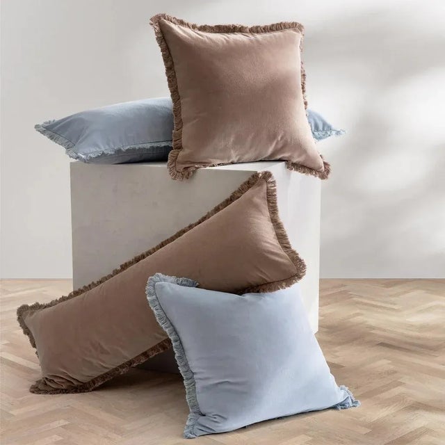 Add a layer of comfort and sophistication with these soft, 100% cotton velvet throw pillows featuring allover fringe and...