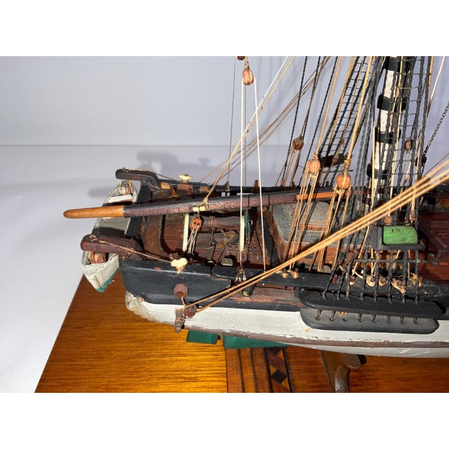 Model of the armed brig Jessie of New York. Fitted with eight cannon on deck. Hull is painted green and white. Rigged with...