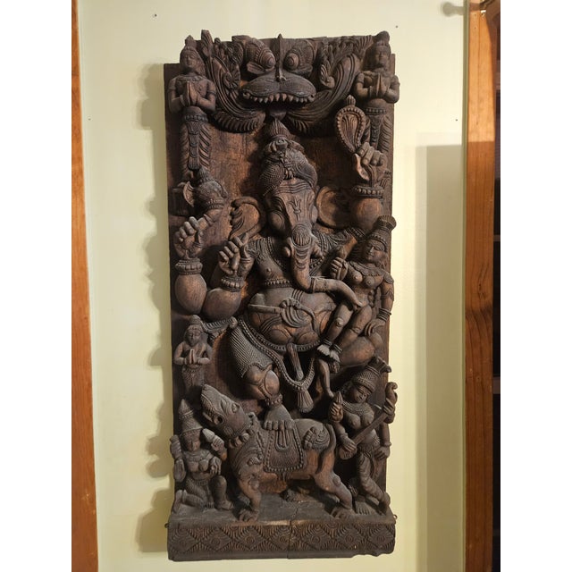 Monumental hand-carved teak Ganesha relief panel with striking high-relief depth and exceptional sculptural presence. This...