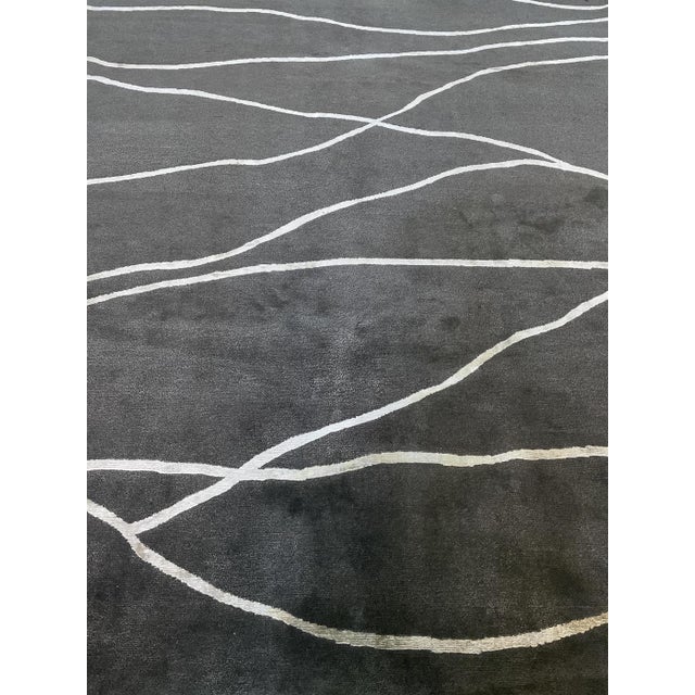Beautiful hand knotted modern and fashionable collection of borderless designs rug, made of 75% wool and 25% cotton in...